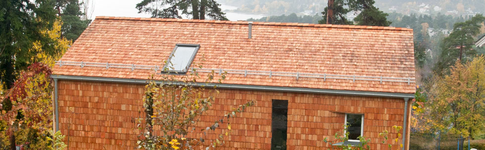 slide16.jpg - Our workmanship of completed envelope of cladded larch shingles on single family house. We invite to check out all the details of a work.